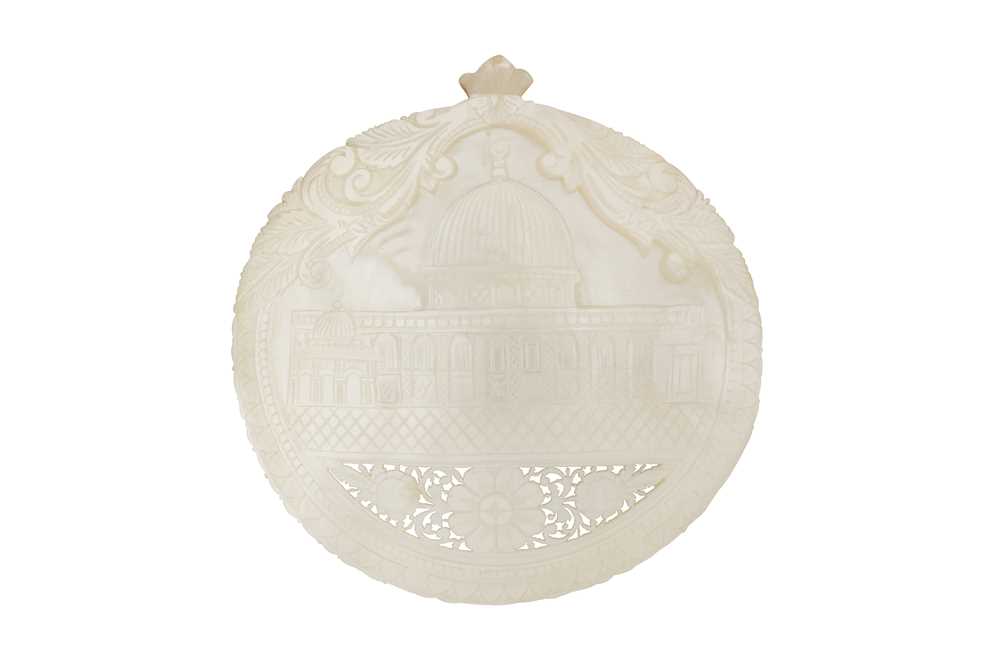 Lot 385 - λ A CARVED AND PIERCED MOTHER-OF-PEARL SHELL PLAQUE WITH THE DOME OF THE ROCK SHRINE