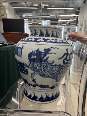 Lot 608 - A CHINESE BLUE AND WHITE 'QILIN' BALUSTER VASE