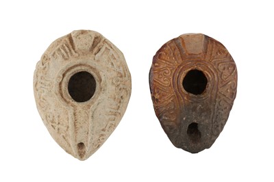 Lot 105 - TWO MOULDED EARLY ISLAMIC POTTERY OIL LAMPS
