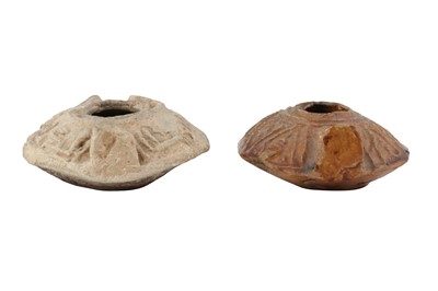 Lot 105 - TWO MOULDED EARLY ISLAMIC POTTERY OIL LAMPS