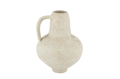 Lot 103 - AN UNGLAZED POTTERY JUG WITH INCISED DECORATION