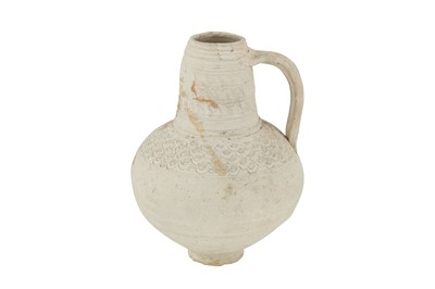 Lot 103 - AN UNGLAZED POTTERY JUG WITH INCISED DECORATION
