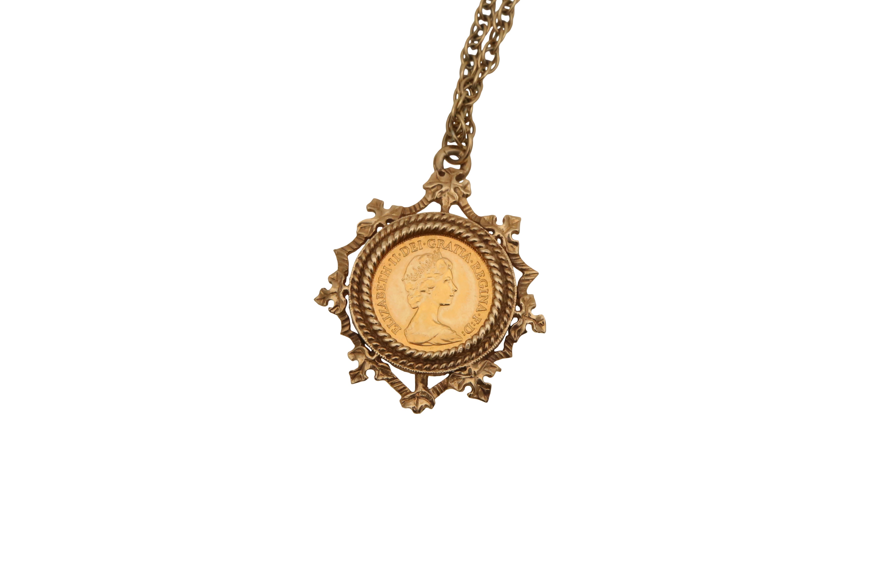 Lot 1060 - A HALF SOVEREIGN IN 9CT GOLD MOUNT AND