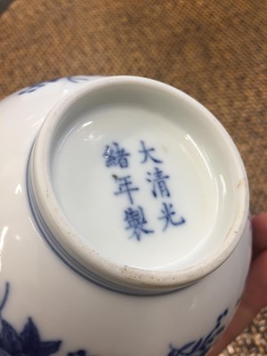 Lot 599 - A CHINESE BLUE AND WHITE 'FLOWERS AND PEACHES' BOWL