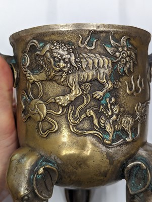 Lot 696 - A CHINESE BRONZE 'LION DOG' TRIPOD CENSER AND COVER