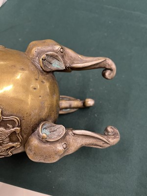 Lot 696 - A CHINESE BRONZE 'LION DOG' TRIPOD CENSER AND COVER
