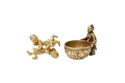 Lot 531 - A CHINESE GILT-BRONZE SCROLL WEIGHT AND A POLISHED-BRONZE CUP