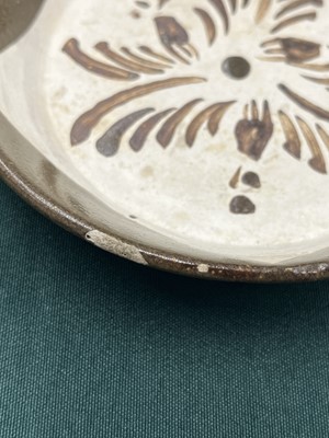 Lot 441 - A CHINESE CIZHOU BROWN-GLAZED AND PAINTED DISH