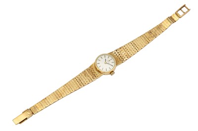 Lot 1116 - A LADIES 14K GOLD TISSOT BRACELET WATCH