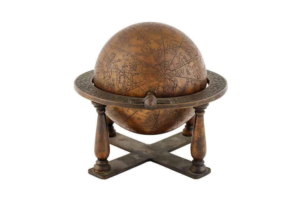 Lot 238 - AN ENGRAVED BRASS ISLAMIC CELESTIAL GLOBE