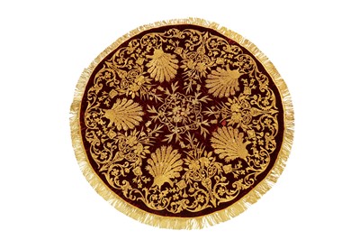 Lot 526 - A CIRCULAR METAL THREAD-EMBROIDERED BURGUNDY RED VELVET SOFRA (TABLE COVER)