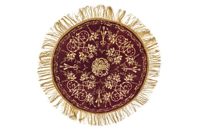 Lot 525 - A CIRCULAR METAL THREAD-EMBROIDERED PURPLE VELVET SOFRA (TABLE COVER)