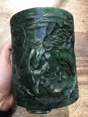 Lot 58 - A CHINESE SPINACH-GREEN JADE 'SEVEN SAGES' BRUSH POT, BITONG