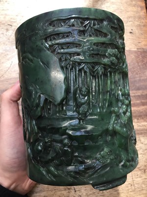 Lot 58 - A CHINESE SPINACH-GREEN JADE 'SEVEN SAGES' BRUSH POT, BITONG