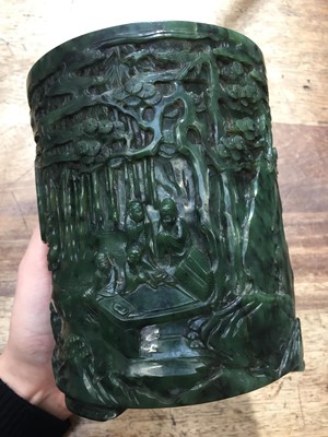 Lot 58 - A CHINESE SPINACH-GREEN JADE 'SEVEN SAGES' BRUSH POT, BITONG