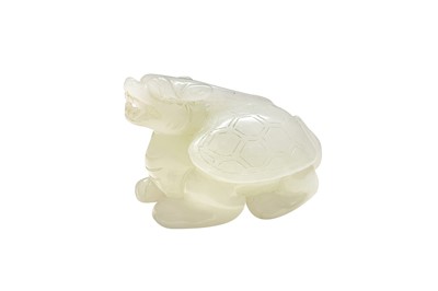 Lot 69 - A CHINESE PALE-CELADON JADE CARVING OF A LONGGUI