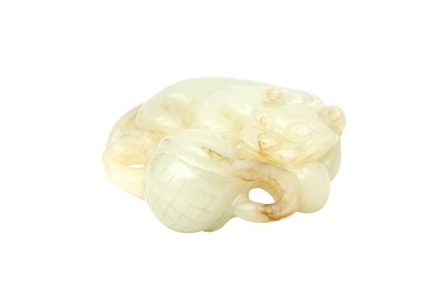 Lot 79 - A CHINESE CELADON JADE CARVING OF A LION DOG