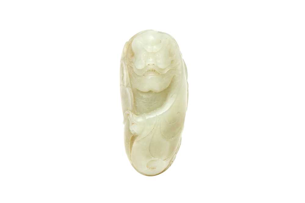 Lot 427 - A CHINESE CELADON JADE CARVING OF A BODHIDHARMA