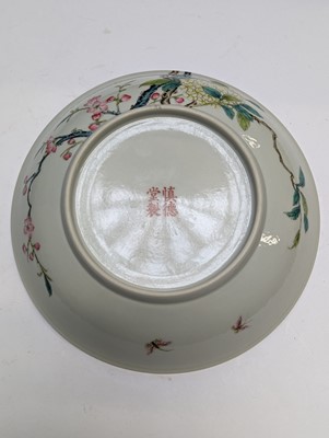 Lot 131 - A PAIR OF CHINESE FAMILLE-ROSE 'FLOWER AND BUTTERFLY' DISHES