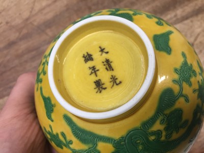Lot 33 - A CHINESE YELLOW-GROUND 'BIRDS AND PEACHES' BOWL