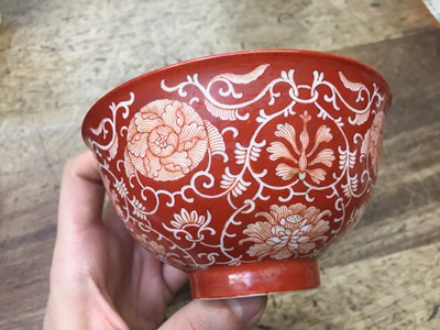 Lot 690 - A CHINESE IRON-RED 'LOTUS SCROLL' BOWL