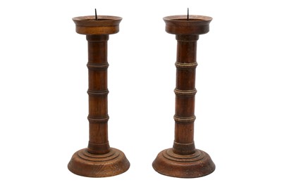 Lot 448 - A PAIR OF TURNED OAK PRICKET CANDLESTICKS