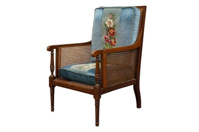 Lot 1443 - A REGENCY STYLE MAHOGANY AND LINE INLAID BERGERE ARMCHAIR, LATE 19TH CENTURY