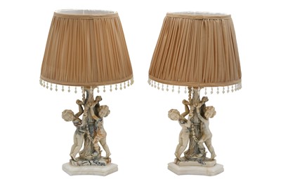 Lot 300 - A PAIR OF MOULDED FAUX MARBLE TABLE LAMPS AND SHADES