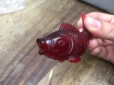 Lot 532 - λ A CHINESE RED BEIJING GLASS 'FISH' SNUFF BOTTLE