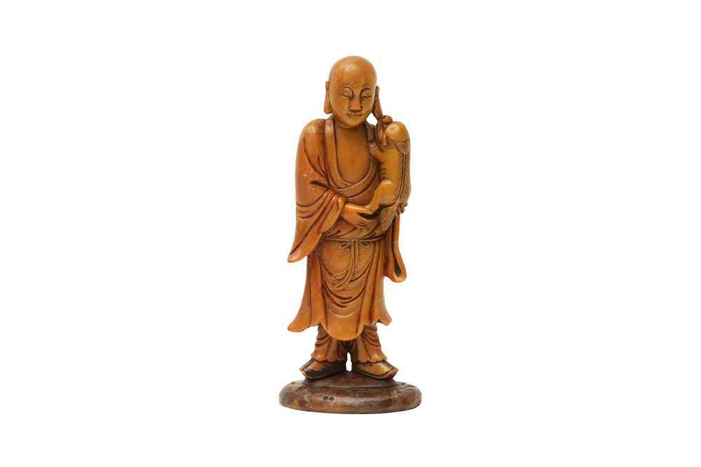 Lot 552 - A CHINESE SOAPSTONE FIGURE OF A MONK