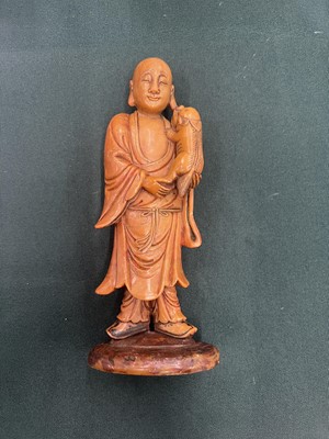 Lot 552 - A CHINESE SOAPSTONE FIGURE OF A MONK