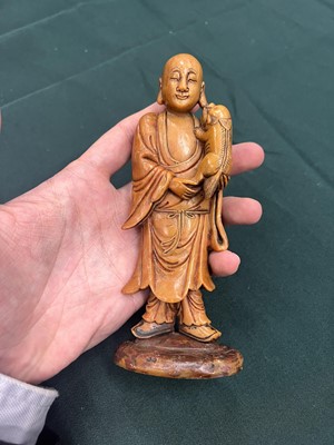 Lot 552 - A CHINESE SOAPSTONE FIGURE OF A MONK