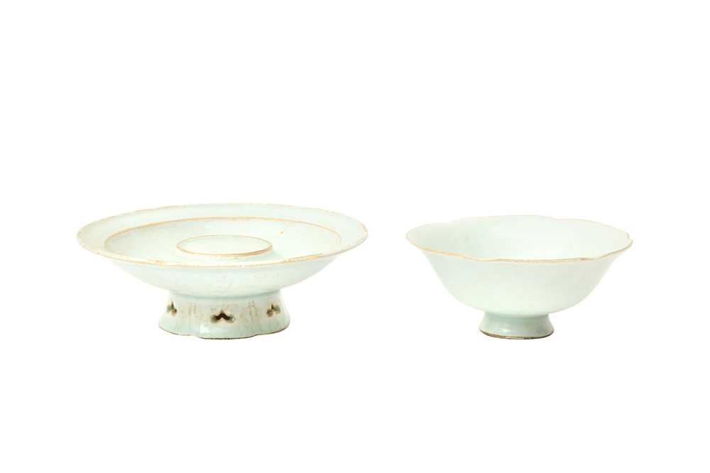 Lot 116 - A CHINESE QINGBAI FOLIATE CUP AND STAND