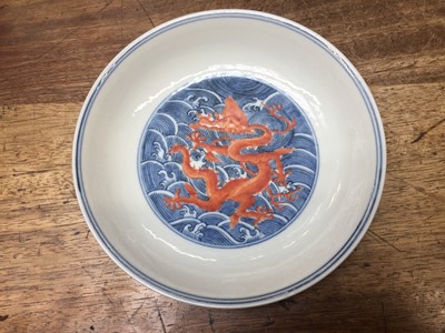 Lot 60 - A PAIR OF FINE CHINESE BLUE AND WHITE AND IRON-RED 'DRAGON' DISHES