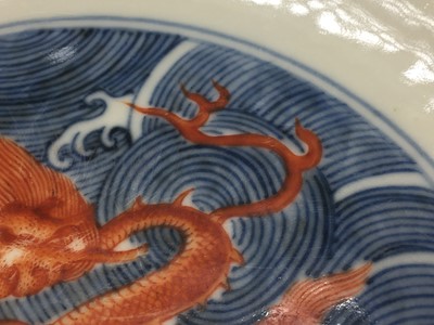 Lot 60 - A PAIR OF FINE CHINESE BLUE AND WHITE AND IRON-RED 'DRAGON' DISHES