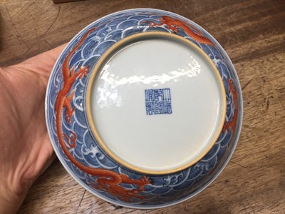 Lot 60 - A PAIR OF FINE CHINESE BLUE AND WHITE AND IRON-RED 'DRAGON' DISHES