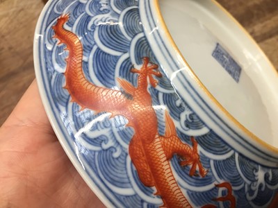 Lot 60 - A PAIR OF FINE CHINESE BLUE AND WHITE AND IRON-RED 'DRAGON' DISHES