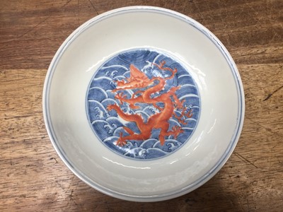 Lot 60 - A PAIR OF FINE CHINESE BLUE AND WHITE AND IRON-RED 'DRAGON' DISHES