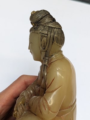 Lot 51 - A CHINESE SOAPSTONE FIGURE OF GUANYIN