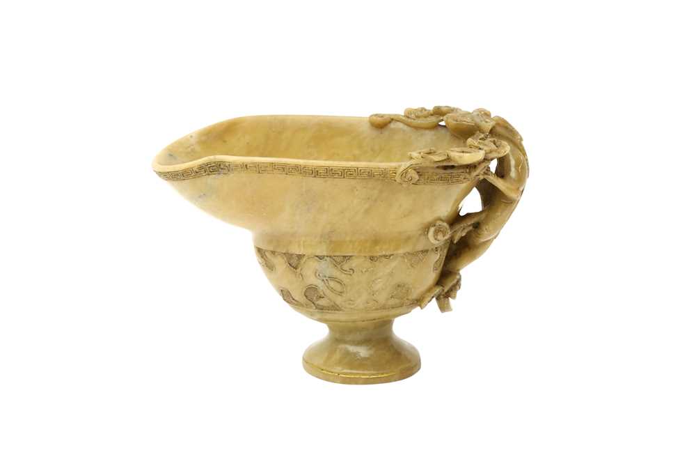 Lot 54 - A CHINESE SOAPSTONE 'CHILONG' LIBATION CUP