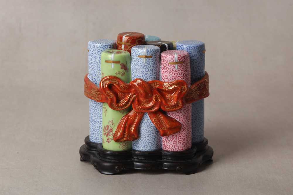 Lot 180 - A CHINESE FAMILLE-ROSE TROMPE L'OEIL 'FIRECRACKER' BOX AND COVER
