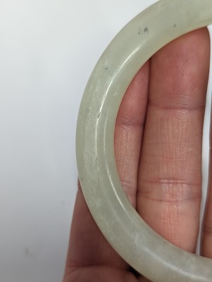 Lot 146 - TWO CHINESE CELADON JADE BANGLES