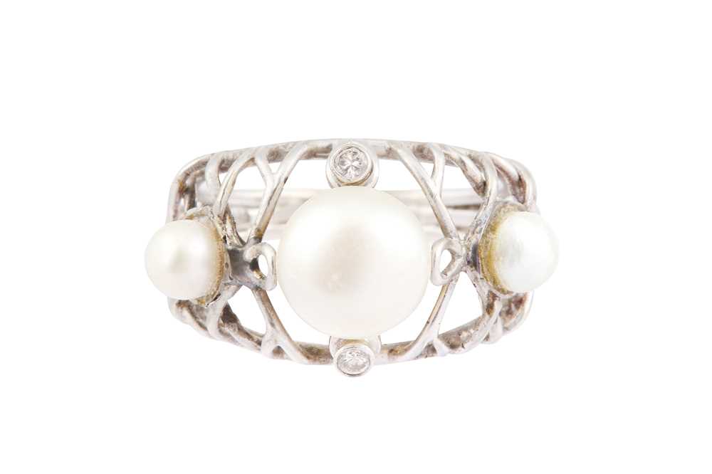 Lot 66 - A THREE NATURAL PEARL RING