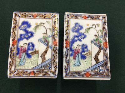 Lot 229 - A SET OF FOUR CHINESE FAMILLE-ROSE SQUARE BRUSH POTS