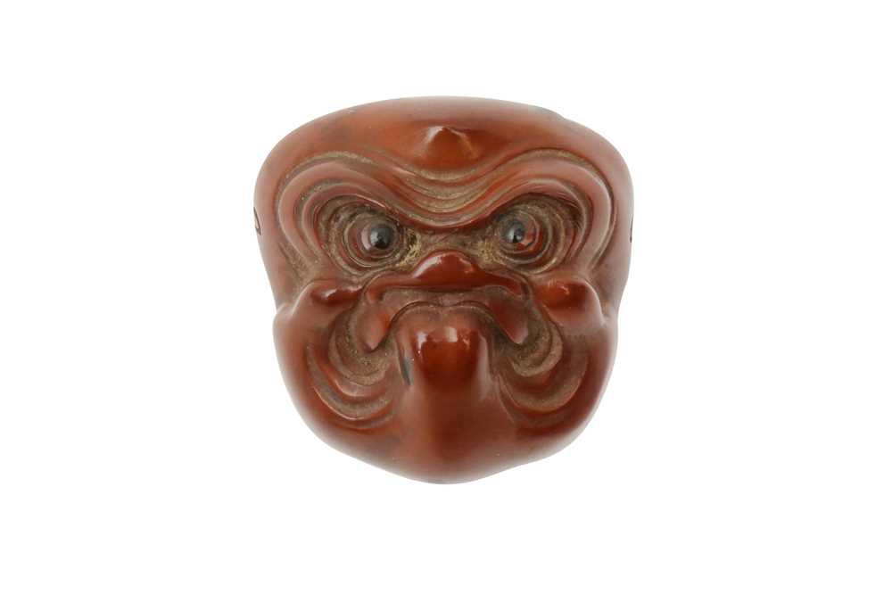 Lot 291 - A JAPANESE WOOD NETSUKE OF A MASK