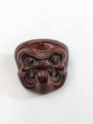 Lot 291 - A JAPANESE WOOD NETSUKE OF A MASK