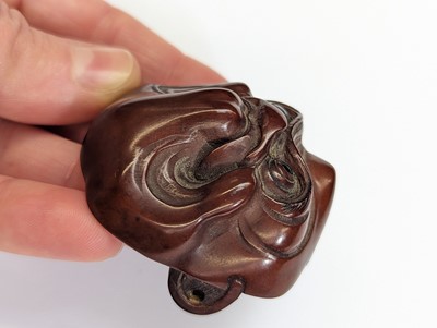 Lot 291 - A JAPANESE WOOD NETSUKE OF A MASK