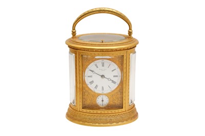 Lot 88 - AN OVAL REPEATER CARRIAGE CLOCK