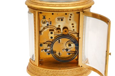 Lot 88 - AN OVAL REPEATER CARRIAGE CLOCK