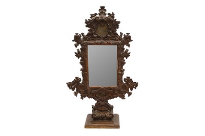 Lot 214 - AN UNUSUAL 18TH CENTURY AND LATER ITALIAN CARVED GILTWOOD FREESTANDING MIRROR